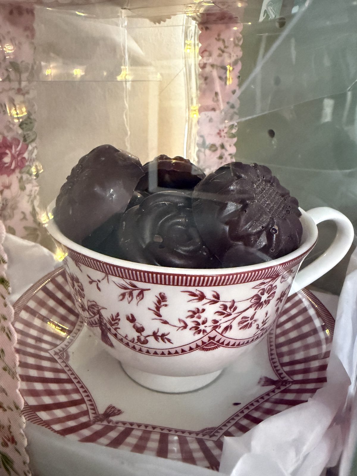 Close-up of chocolate Nutella truffles in a floral teacup